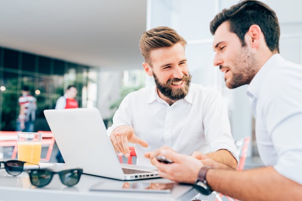 two-young-bearded-caucasian-modern-business-man-sitting-in-a-bar-using-laptop-looking--SBI-304229244